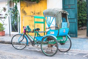 The horse carriages I saw in the museum were larger, grander version of this cycle rickshaw.